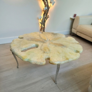 sand dollar coffee table 44"wx18"t 3200.00